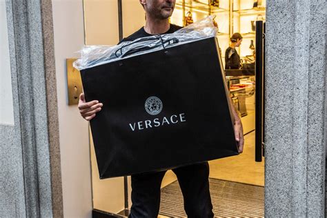 business of fashion michael kors buys versace|michael kors acquisition.